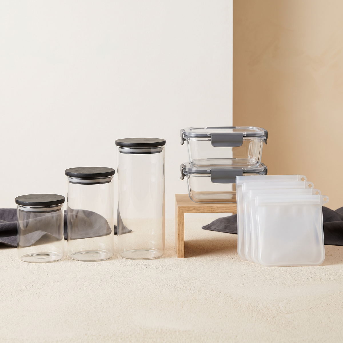 Glass storage jars with bamboo lids, stackable containers and a pantry riser