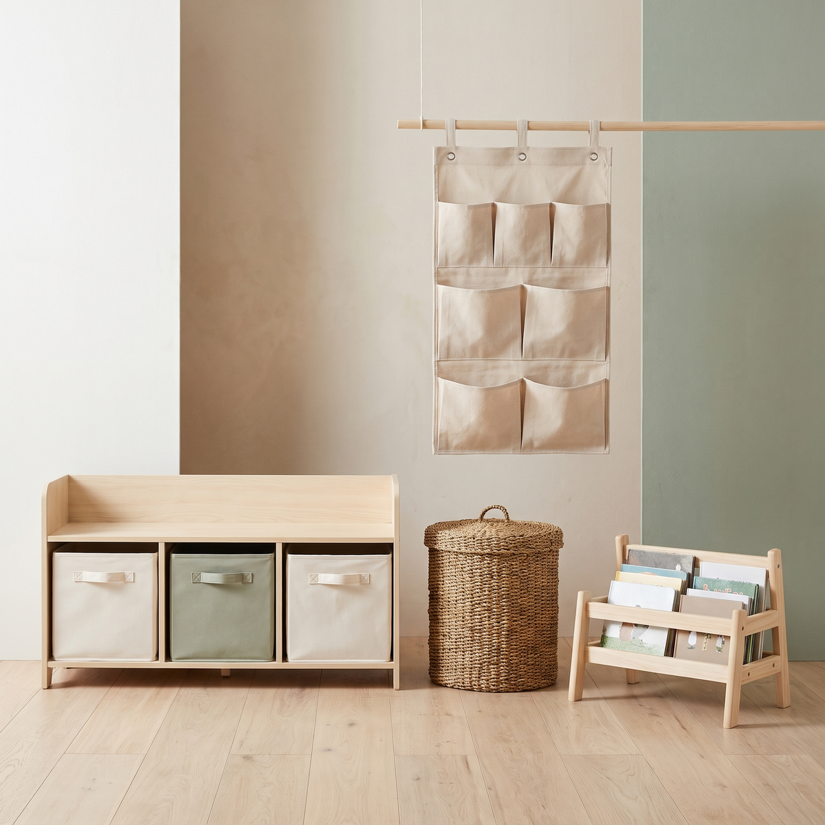 Low oak toy shelf with fabric bins, a lidded toy basket and a book caddy