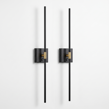 Ansel cordless wall sconces, set of two — slim black metal rods on small square wall plates with a brass collar, on a white background